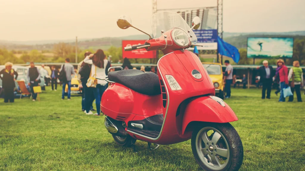 A clean, second-hand scooter navigates a city street, showcasing a hassle-free and affordable way to commuting.