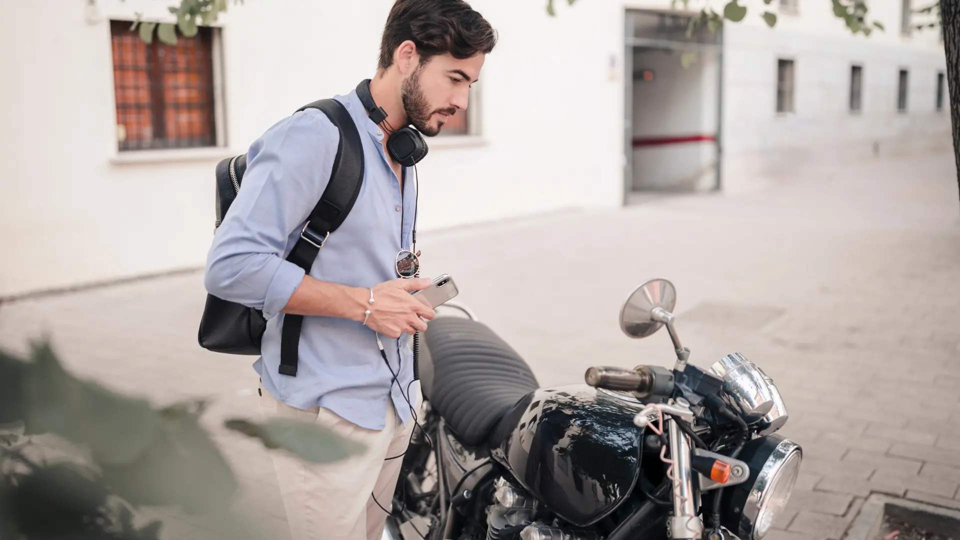 Man with backpack near a bike